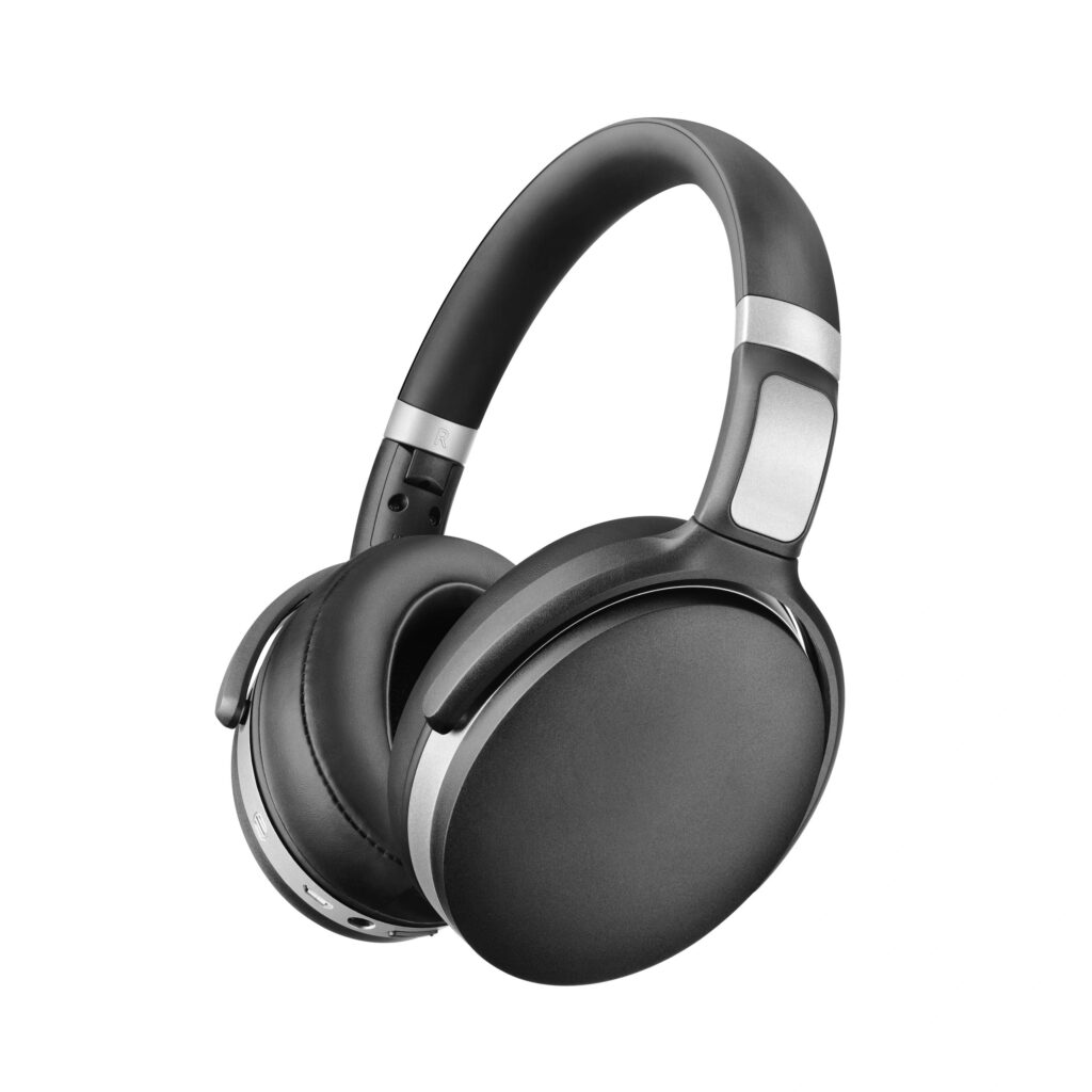Bluetooth Headphones Isolated on White Background. Side View Black Silver Wireless Over-the-Ear Headset With Noise Cancelling and Integrated Microphone. Acoustic Stereo Sound System